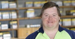 James who has Down syndrome at work