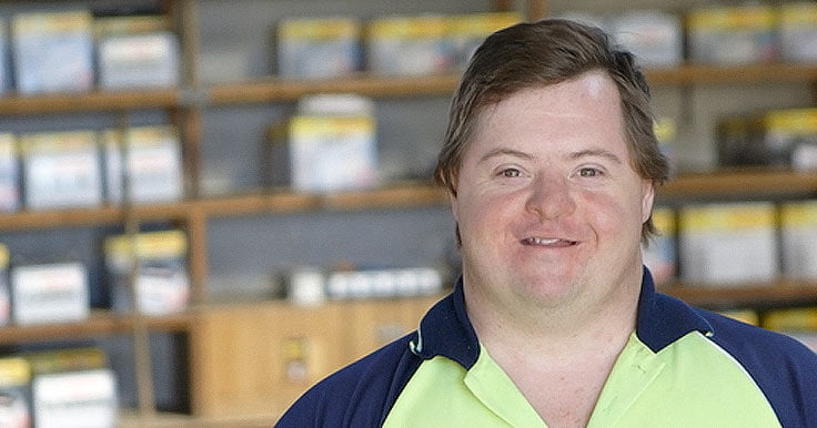 James who has Down syndrome at work