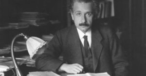 Einstein sitting in his study