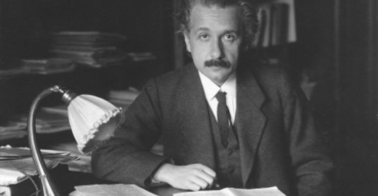 Einstein sitting in his study
