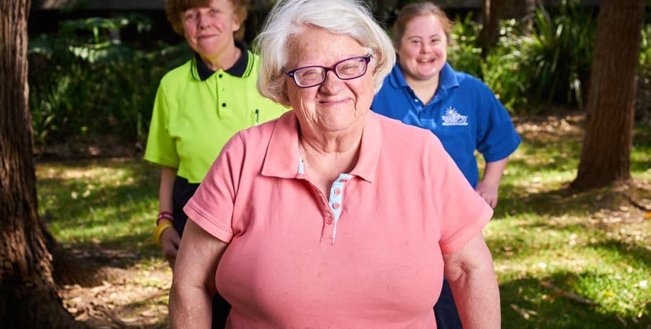 Woman with a disability celebrating International Day of People with a Disability