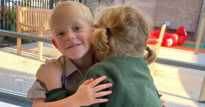 A boy and girl hugging