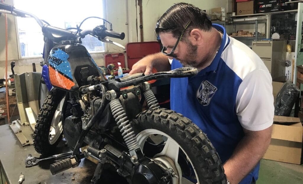 Wal gives it a grease and oil