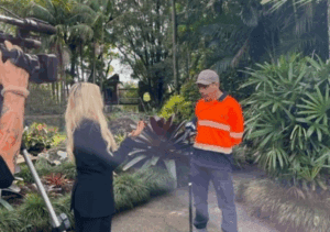 A supported employee from summerland farm being interviewed for the news.