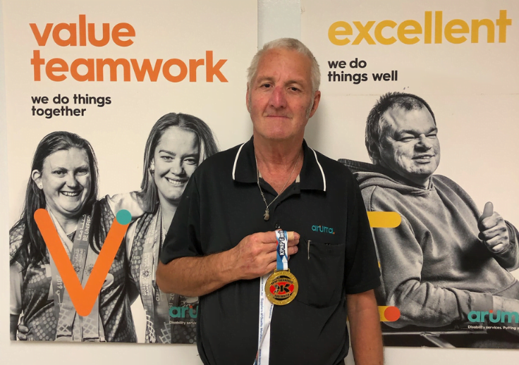 Daniel Phillips from Burleigh holding his new gold medal for taekwondo.