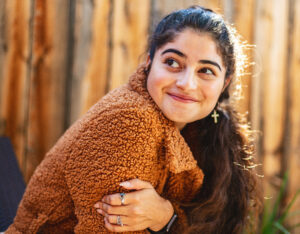 A young person looking relaxed and content, reflecting positive behaviour support services for teenagers