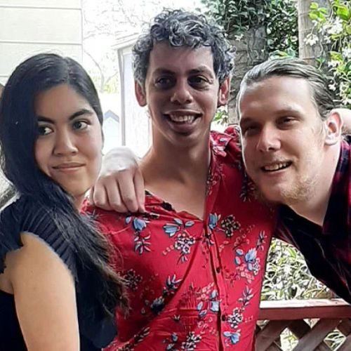 Three housemates in a NDIS SIL pose for the camera