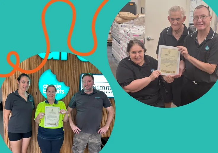 Aussie Biscuits team members proudly holding their NSW Parliament recognition certificates at the Aussie Biscuits and Summerland Farm facilities.