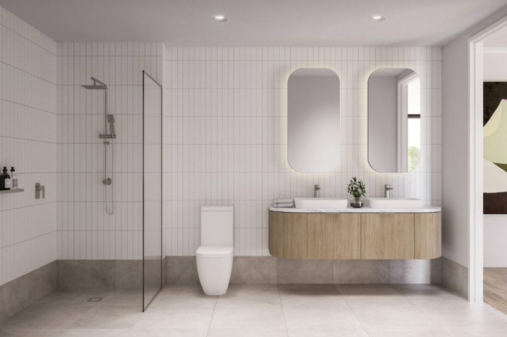 Accessible bathroom Accessible bathroom at Casa Tranquila with a step-free walk-in shower, wall-hung vanity, dual mirrors and white vertical tiling.