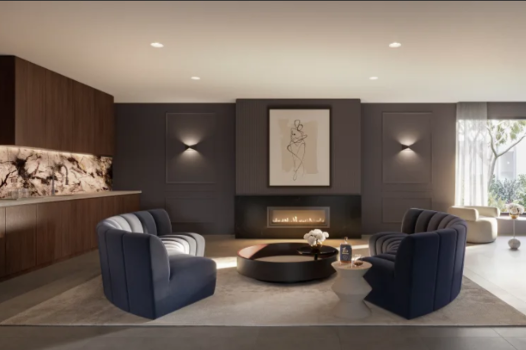 Resident's cocktail lounge Resident's cocktail lounge at Casa Tranquila with navy armchairs, a feature fireplace, soft lighting and a wet bar with stone splashback.