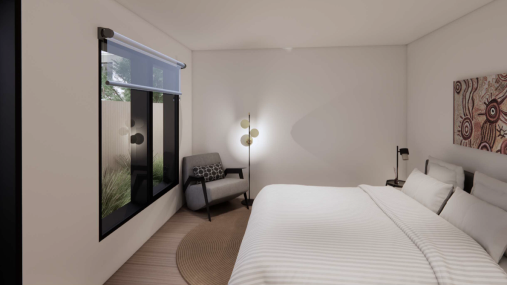 Render of a bedroom inside a Ringwood East SDA home, showing a double bed, reading chair, bedside lamp, artwork on the wall and a large window with courtyard views.