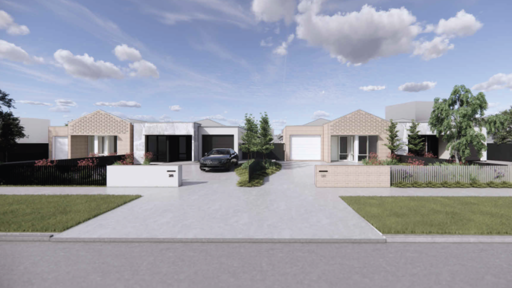Wide street view of the full Thomastown SDA development, showing four co-located homes with modern brick and rendered exteriors, landscaped front yards, individual garages and a central shared driveway.
