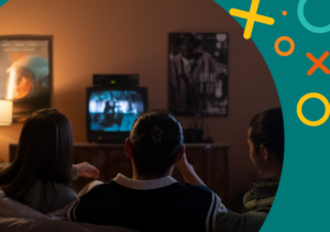 image showing people sitting down watching a movie on television