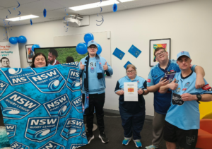 Image of a group of participants celebrating the Blues' win at Charlestown Hub.