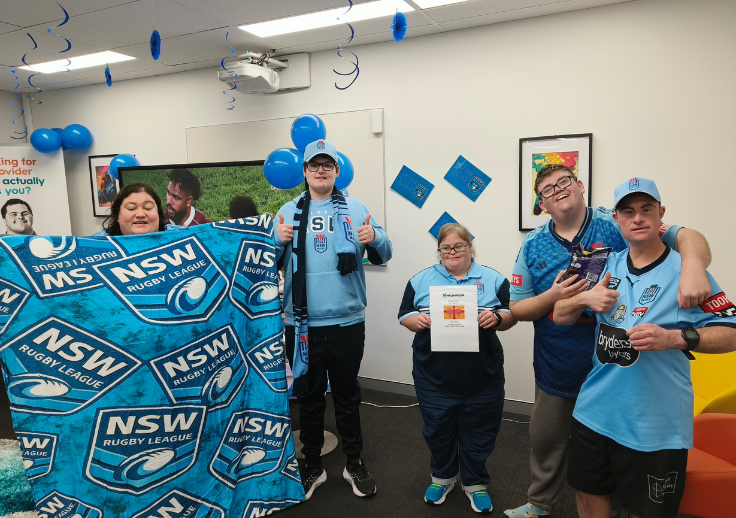 Image of a group of participants celebrating the Blues' win at Charlestown Hub.