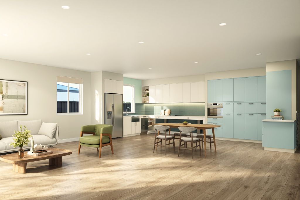 Open-plan kitchen, dining and living area inside the Wangaratta SDA home, showing timber-look flooring, white and duck-egg blue cabinetry, an accessible island bench and dining setting.