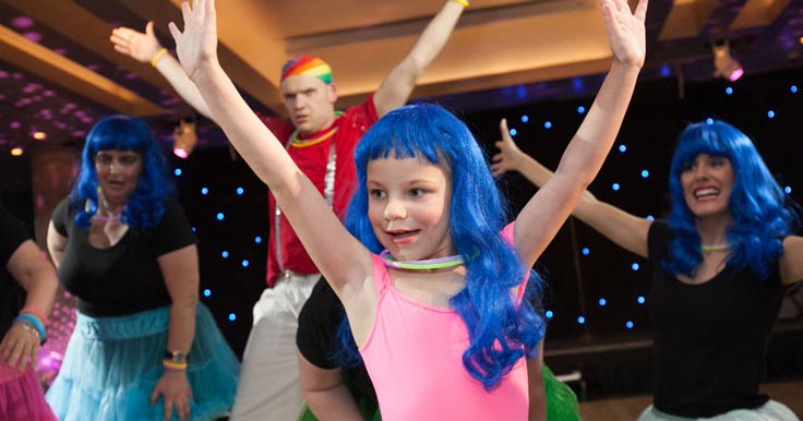 Zayla dancing in a blue wig