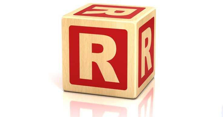 Wooden block with the letter R on it