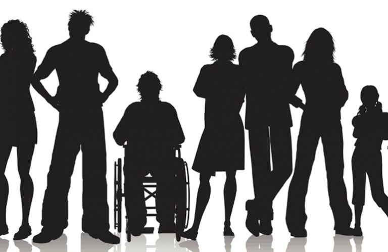 Group of people as silhouettes standing in a line