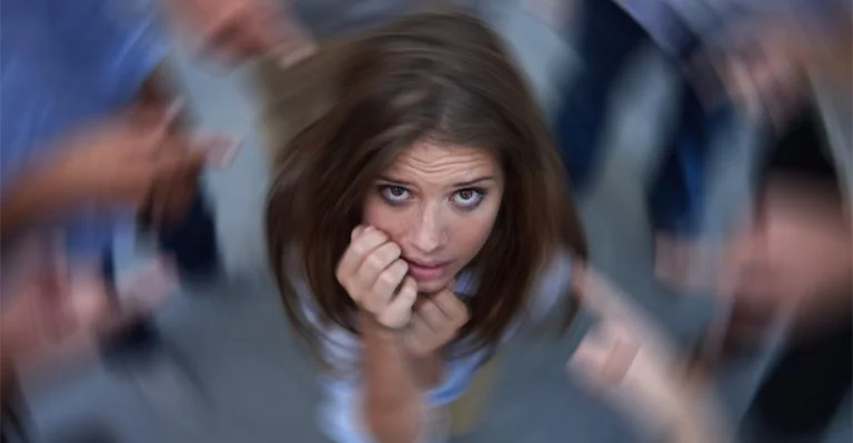 Women having a panic attack while the world spins around her