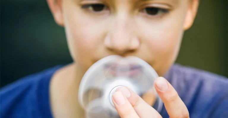 Boy stimming by using a fidget spinner
