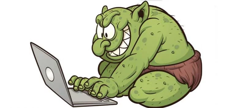 Cartoon troll typing on a computer