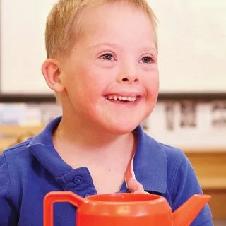 Boy with Down syndrome in an Early Childhood's disability service