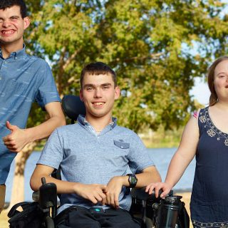 Three Aruma customers hanging out in their disability service