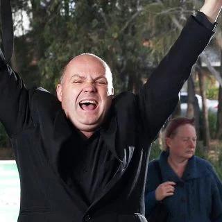 Man celebrating with his hands in the air