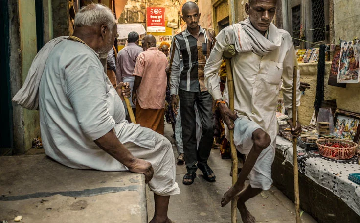 Man who had polio walking with crutches