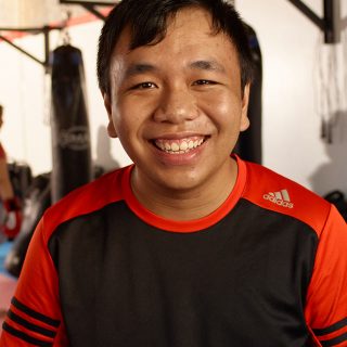 Man with a disability at a gym which is a part of his NDIS plan