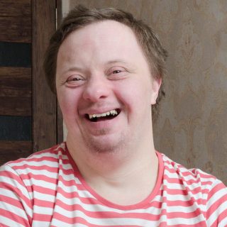 Man with Down syndrome smiling
