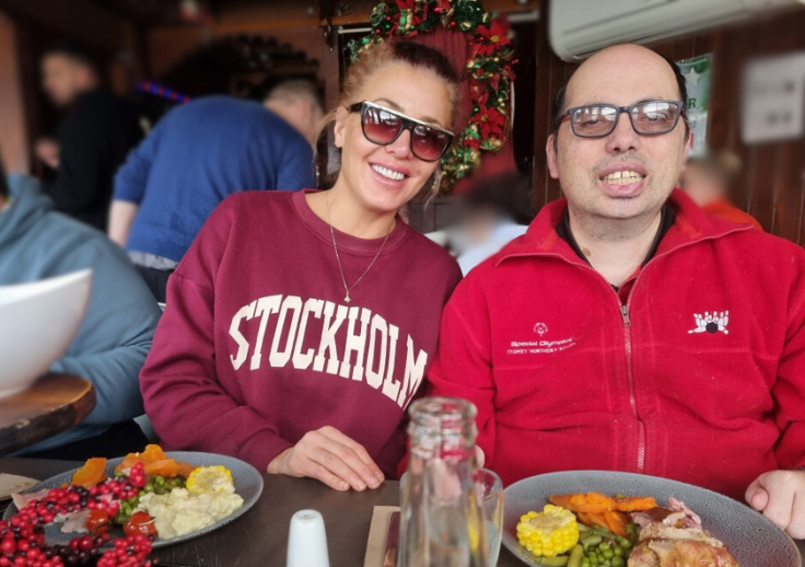 Steve and support worker on the river cruise for christmas in july.